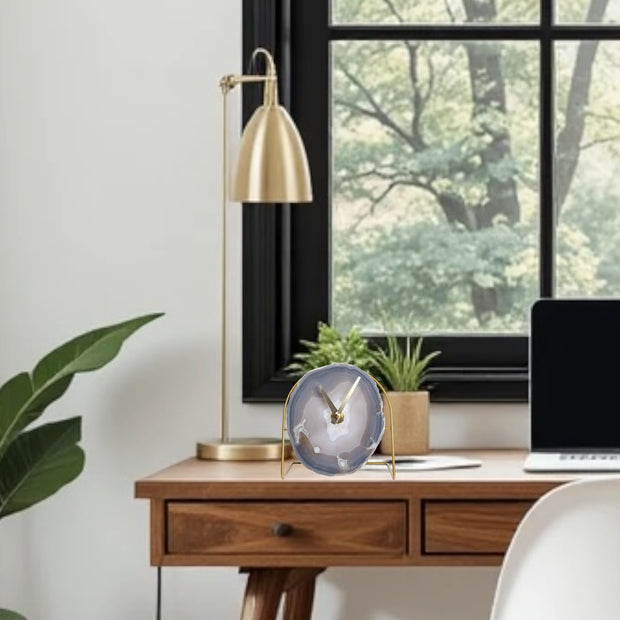 a laptop computer sitting on top of a wooden desk