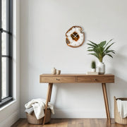 a wooden table with a potted plant on top of it