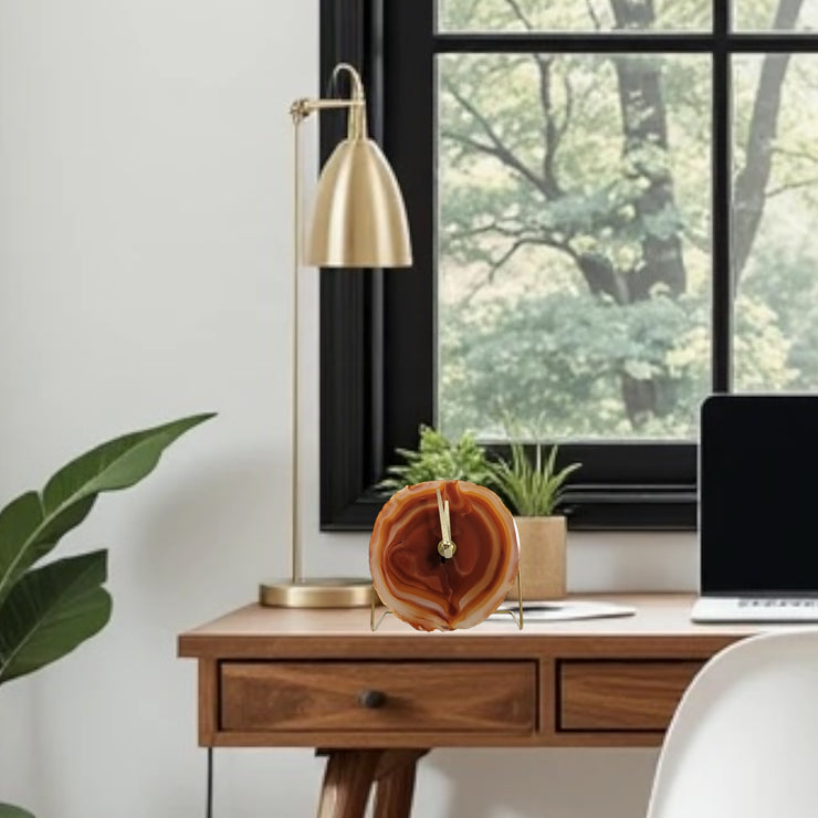 a desk with a laptop and a plant on it