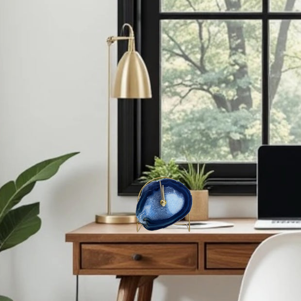 a laptop computer sitting on top of a wooden desk