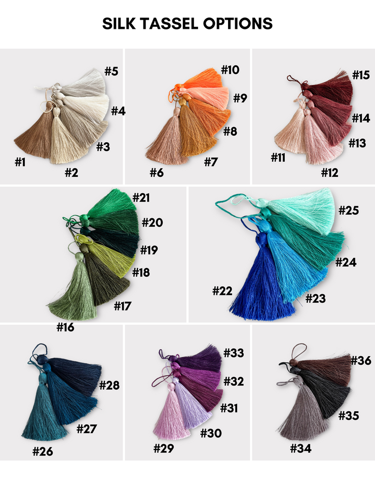 a bunch of different colors of tassels