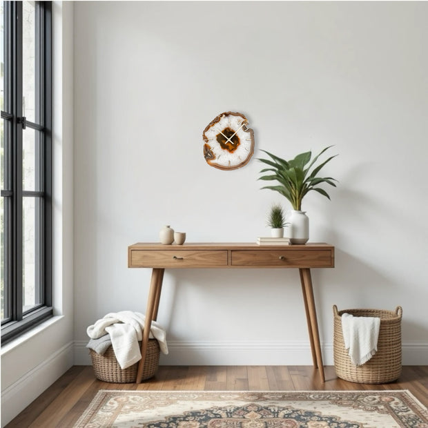 a room with a rug, a table and a potted plant