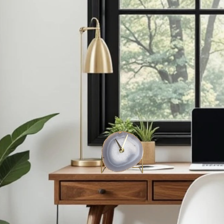 a laptop computer sitting on top of a wooden desk