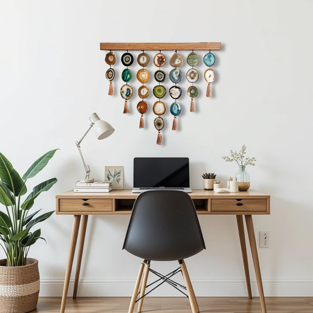 a desk with a laptop and a plant on it