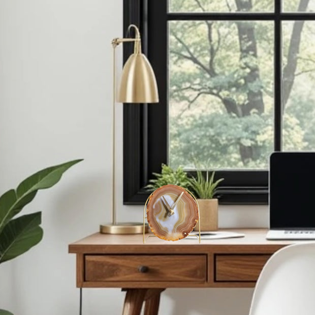 a laptop computer sitting on top of a wooden desk