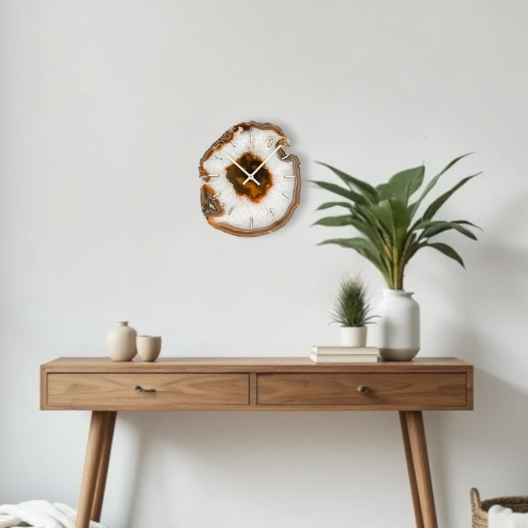 a table with a plant and a clock on it