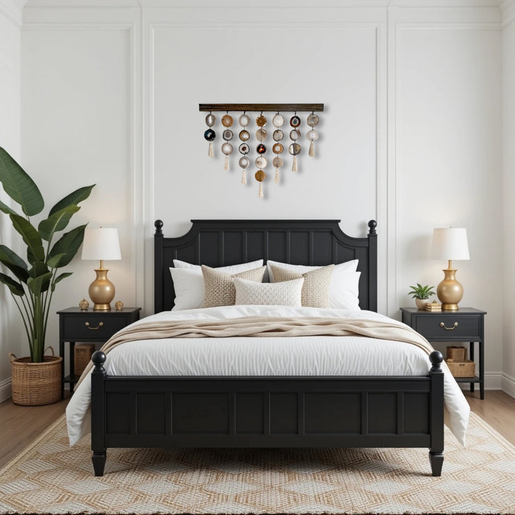 a bedroom with white walls and a black bed